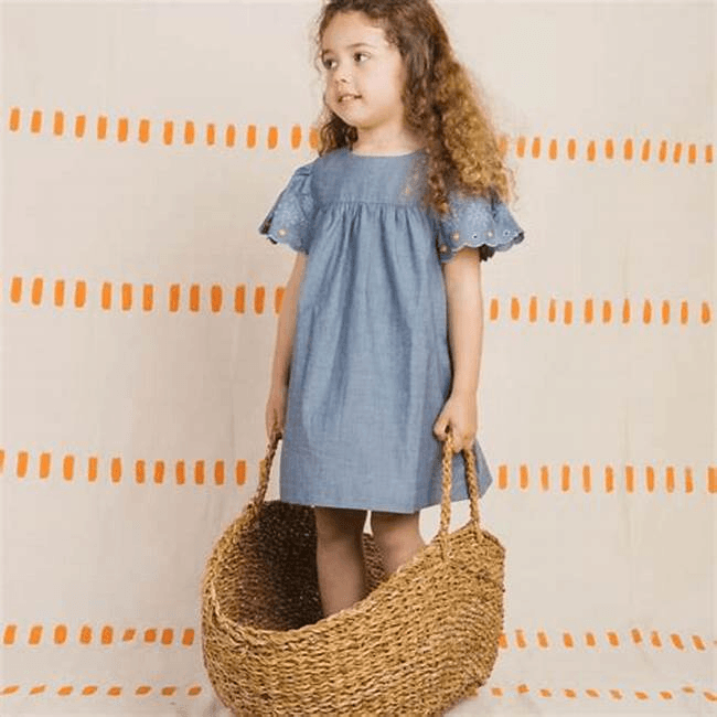 Child in denim dress