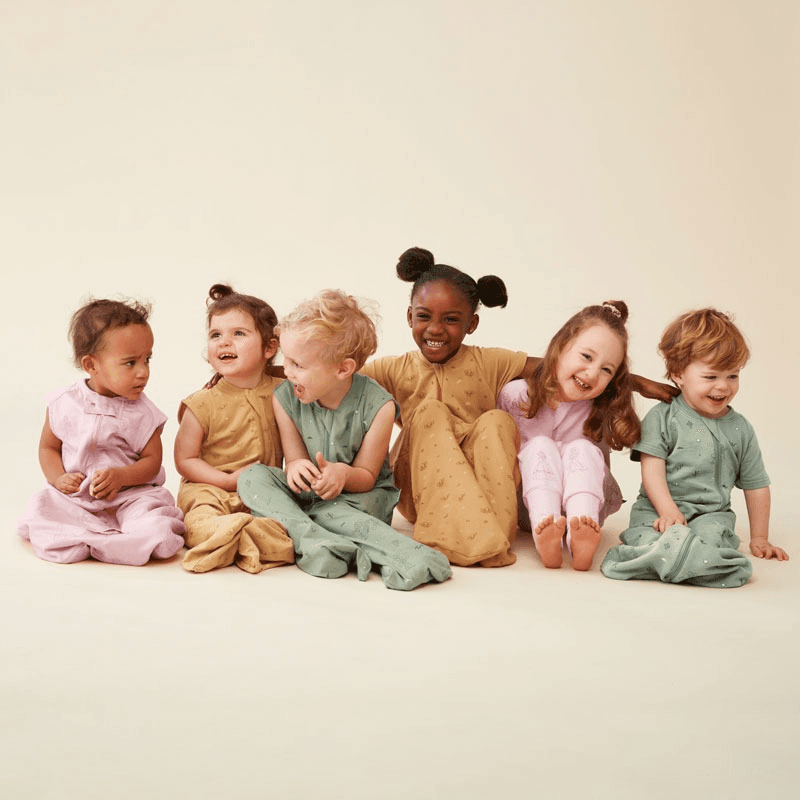 Children wearing pastel colored Mitly clothing