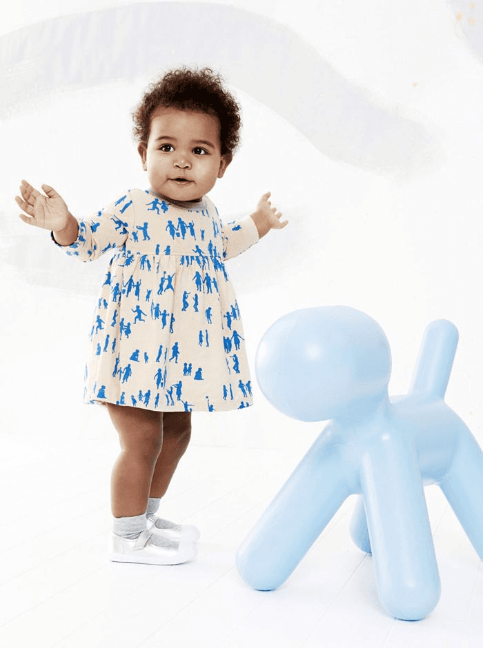 Child in patterned white dress