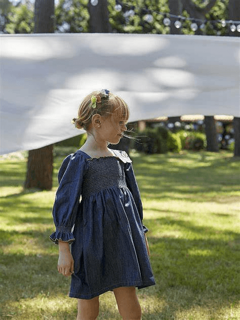 Child in navy dress